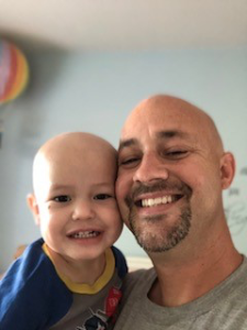 Dad and child smiling