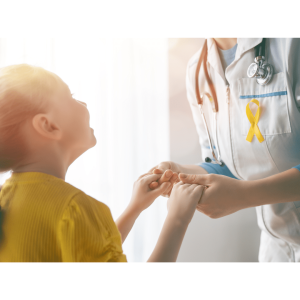 Pediatric patient holding hands with worker